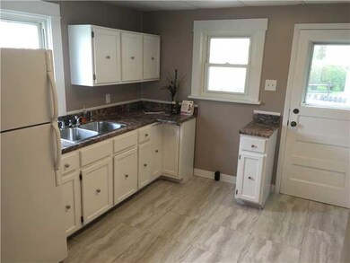 Kitchen. The kitchen has new flooring, countertop,