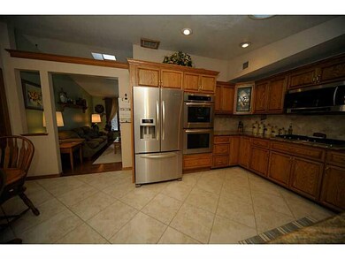 Kitchen. The beautiful kitchen features granite co