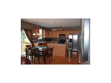 Large kitchen features a lot of cabinet space, ove