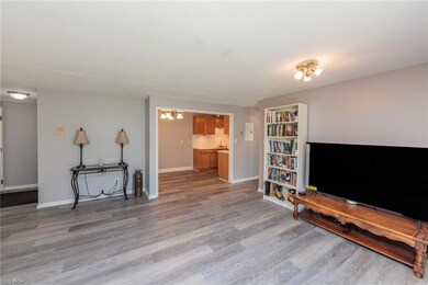 Hardwood floored living room featuring sink