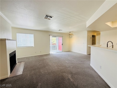 Unfurnished living room with a textured ceiling, v
