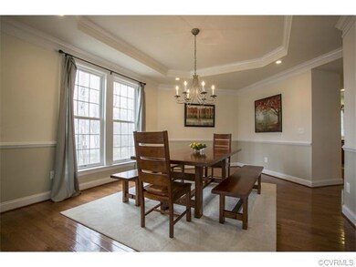 Dining room with tray ceiling.
