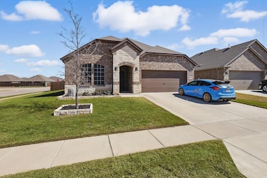 French country inspired facade featuring driveway,