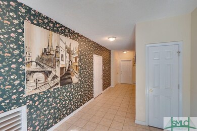Entry foyer on ground level.  Secure doors into th