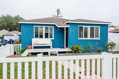 Exterior view with garage at end of long driveway