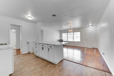 view from kitchen to family room (new range to be