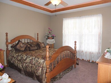 Master suite with tray ceiling and private master 
