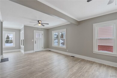 LIVING ROOM - Looking towards the entry & sunroom.