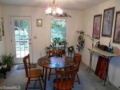 Dining Room. Dining room is off of the living room and adjoins to the kitchen.  Also, you can access the back deck through this room.