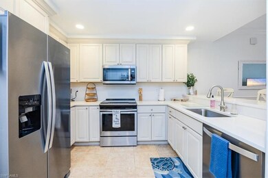 Kitchen with stainless steel appliances, quartz co