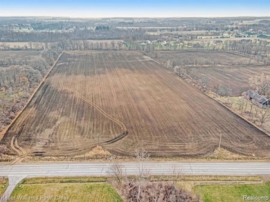 40 Acres on Paved road ,Half Mile from water line,