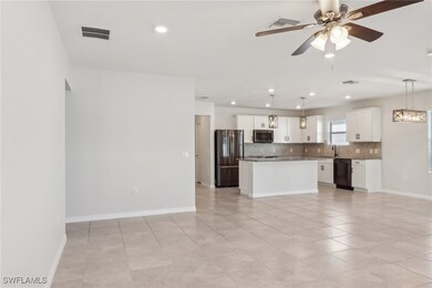 Kitchen with tasteful backsplash, stainless steel