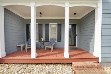 View of exterior entry with a porch