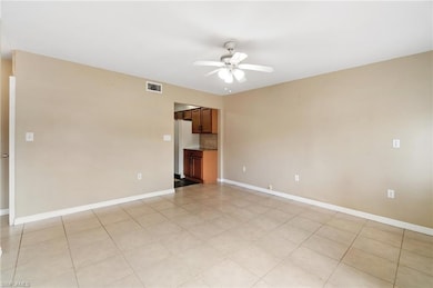 Unfurnished room with visible vents, baseboards, a