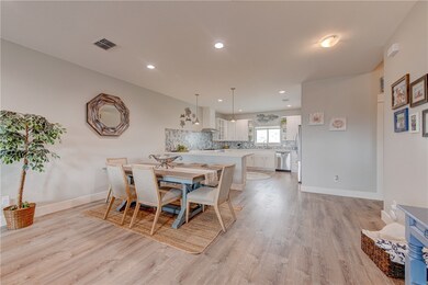 Open kitchen, dining, living.