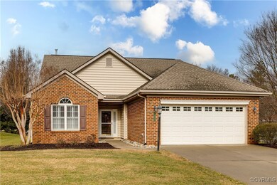 Manicured Front Yard with 2-Car Garage.