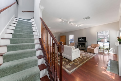 Beautiful wood floors add warmth and elegance throughout the main living areas.