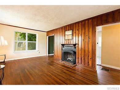 Living Room: original wood paneled accent wall