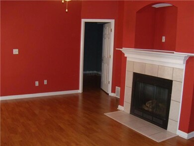 The living room splits the master bedroom from the