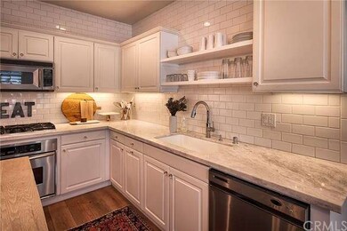 Marble countertops, subway tile backsplash, and st