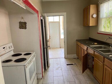 Kitchen with plenty of natural light, sink, white 