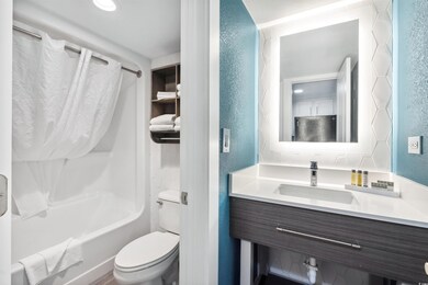 Full bathroom featuring shower / bathing tub combination, vanity, and toilet