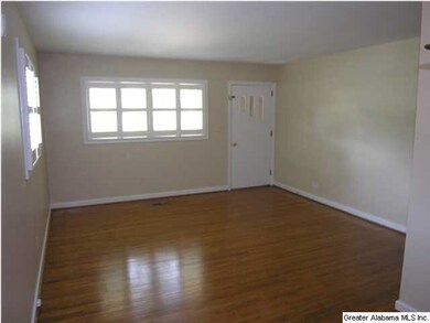 Living room with gleaming hardwood floors