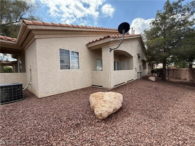 Rear view of property featuring cooling unit, stuc