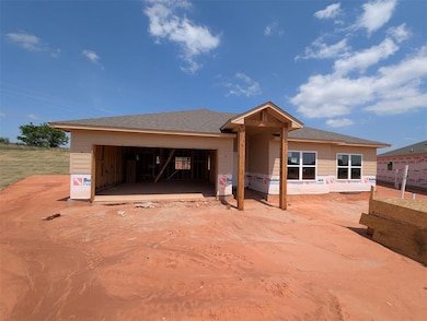 Property in mid-construction with a garage
