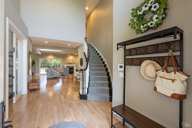 Spacious entry that leads you to the great room, family room, kitchen, downstairs primary suite and laundry room.