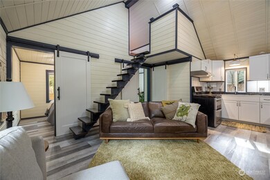 The main living area is artistic and pleasing with beautiful shiplap and trim.