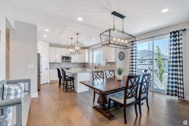 Enjoy meals in this light-filled dining area, bathed in natural light from sliding glass doors that open directly to the backyard.
