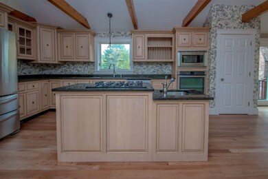 island with cooktop & drop sink