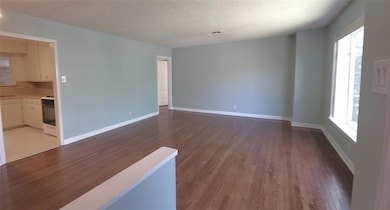 Unfurnished room featuring wood finished floors, 