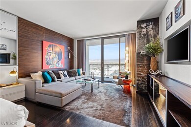 Living room with hardwood / wood-style flooring, a