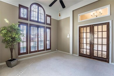 Oversized study with dramatic windows, plantations