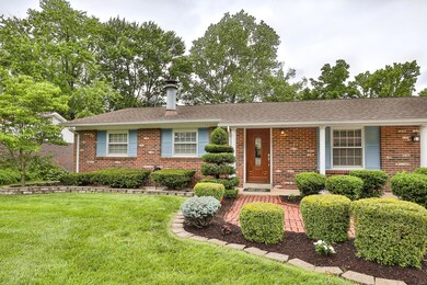 Appealing 20x4 covered front Porch is illuminated by a single sconce light.