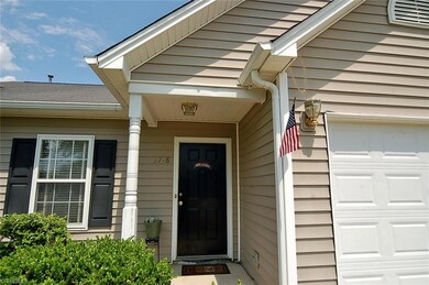 Covered front entry porch.  Vinyl siding on home for easy maintenance.