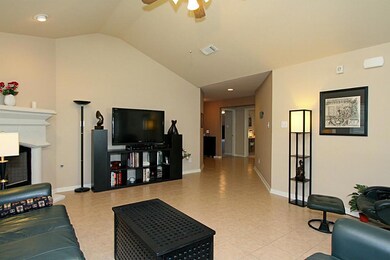 A view of the family room looking toward the entry of the home.  This family room offers tile flooring also!