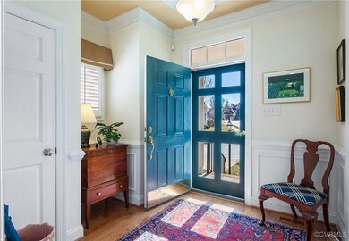 Entrance foyer with visible vents, a decorative wa