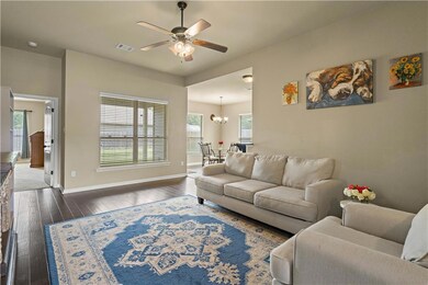 Open and airy living room that overlooks backyard