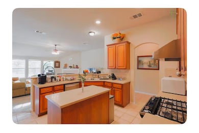 Kitchen featuring light countertops, dishwasher, 