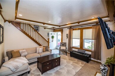 As you enter the home, you are greeted by a 5x4 En