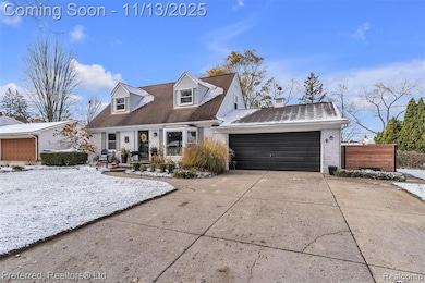 Cape cod home with brick siding, concrete driveway, an attached garage, and roof with shingles