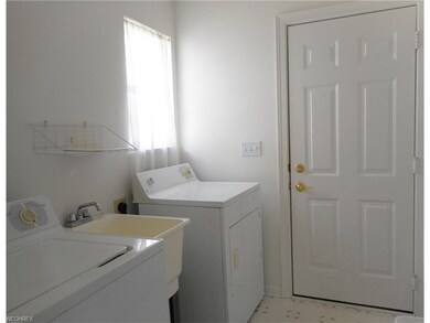 The first floor laundry is located between the kit