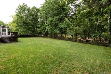Expansive fenced, grass area in the backyard is perfect for all kinds of activities!