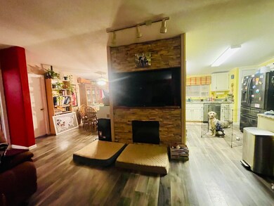 Living room w/ electric fireplace