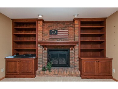 Built-in shelving and cabinets and gas fireplace.