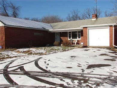 Exterior Front. One step to enter the home.