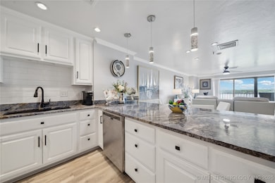 Bright and modern kitchen showcasing granite count